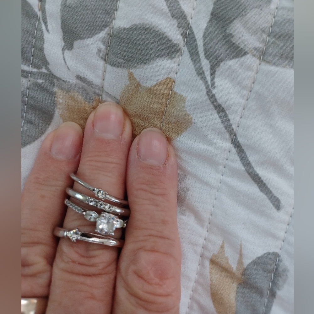 3x silver toned rings size 7.5